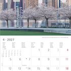 April 2027 Kalender mit Wochenangaben. Oben Skyline mit Kirschblütenbäumen und Hochhäusern im Hintergrund.