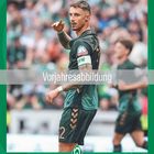 In der Mitte steht "Vorjahresabbildung". Ein Fußballer in grünem Trikot zeigt eine Geste. Unten: Kalender für März.