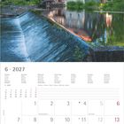 6 · 2027 Kalender mit Juni-Wochen, Feiertagen und Platz für Notizen. Fachwerkhaus am Fluss mit umgebenden Bäumen.