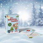„24 x Wichtelzauber“ steht auf der Schachtel, daneben zwei Karten auf Schnee mit Winterhintergrund.