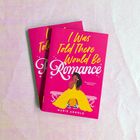 Zwei pinke Buchcover, Titel: "I Was Told There Would Be Romance" von Marie Arnold. Zeichnung: Frau im gelben Kleid auf einer Bank.