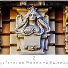 Text: „Art Nouveau, 2, CASAES EDITION“. Relief einer geflügelten Frauenfigur mit Krone und geflochtenem Haar an einer Fassade.