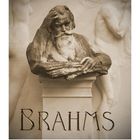 Text: "BRAHMS." Eine Statue eines Mannes sitzt nachdenklich, Details antik und klassisch gehalten. Kalender am unteren Rand.