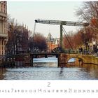 Text: "Ziehbrücke", "2", Zahlensequenz von 1 bis 28. Bild: Alte Brücke über einen Kanal mit Gebäuden und Bäumen.
