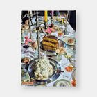 "TOILETPAPER", "PHAIDON". Ein opulent gedeckter Tisch mit Speisen, Kerzenleuchtern und Blumenarrangements.