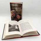 "Diane & Reinhold Messner: LEBENSZEIT, Vom Wert der Vergänglichkeit." Buchcover und ein geöffnetes Buch.