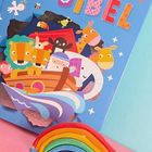 "MEINE BUNTE BIBEL" in bunten Buchstaben. Illustration mit Tieren auf einer Arche und einem Regenbogen im Vordergrund.