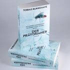 Text auf dem Buch: "TOBIAS BUKKEHAVE. ER MORDET MEISTERHAFT. ER KENNT KEINE GNADE. ER IST... DER PRÄTORIANER. THRILLER." Bild einer Fliege.