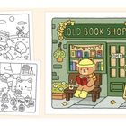 „OLD BOOK SHOP“ Schild über einem Laden in herbstlicher Umgebung. Ein Bär liest auf einer Bank, neben ihm ein offenes Schild.