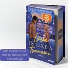 "Mit Farbschnitt nur in limitierter Erstauflage." Ein Buch zeigt ein illustrierte Paar vor Villen. Titel: „Love is Like a Tsunami“.
