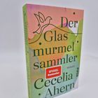 "Der Glasmurmelsammler" von Cecelia Ahern. SPIEGEL Bestseller. Cover mit buntem Design und einer stilisierten Taube.