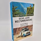 "SECHS JAHRE WELTUMRUNDUNG. Im Lkw-Oldtimer durch 54 Länder." Buchcover mit einem Lkw vor einer Landschaft.