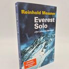 Buchtitel: "Everest Solo" von Reinhold Messner, mit Untertitel "Der gläserne Horizont". Cover zeigt einen Berg.