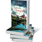 Text: "Pia O'Connell, Tödliche Donau, Kriminalroman". Bücherstapel, Cover zeigt Fluss und Brücke vor dramatischem Himmel.
