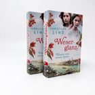 Zwei Bücher stehen nebeneinander. Text: „Weserglanz. Träume von neuen Zeiten. Christiane Lind.“ Abgebildet sind zwei Frauen.