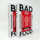 Zwei Bücher mit dem Text "BAD FOOD" und "Wie wir die Kontrolle über unsere Ernährung zurückgewinnen". Roter Einkaufswagen.