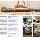 "Der Mega-Transport verlief nach Fahrplan: In zwei Jahren von der Ostsee ins Museum." Ein U-Boot schwebt an Gurten.