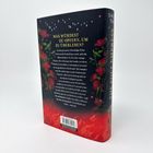 Ein Buchrücken mit einem Text zu einem Machtspiel um den Kaiserthron. Der Hintergrund ist dunkel mit roten Blumen und Flammen.