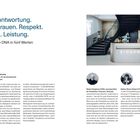 Verantwortung. Vertrauen. Respekt. Mut. Leistung. Unsere DNA in fünf Werten. Empfangsbereich mit Treppe und zwei Porträts.