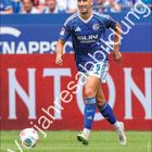 "Voijaresabildung" und "Nikola Katić" über einem jubelnden Fußballer in blauem Schalke-Trikot. Februar-Kalenderseite.