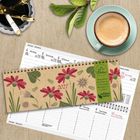 Texte: "2027", "edition natur", "plastekfrei", "umweltpapier". Kalender mit roten Blumen, Tasse Kaffee, Stifte.