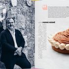 Text: Elsass-Lothringen-Champagne; MONT-BLANC-HOMMAGE. Links ein Mann im Anzug an einer Wand, rechts eine kunstvolle Torte.