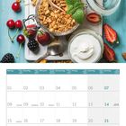 Kalenderseite Februar 2027. Oben Müsli mit Joghurt, Honig, Kirschen und Beeren dekorativ angerichtet auf einem Tisch.