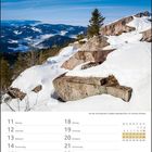 Kalenderseite Januar 2027, Woche 2-3. Foto von verschneiter Berglandschaft mit Felsen und Nadelbaum.