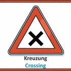 "Kreuzung, Crossing. Rotes Dreieck mit schwarzem Kreuz, weißer Hintergrund."