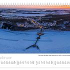 Text: "Die knapp 400 Meter lange Seebrücke vor Sellin im Sonnenuntergang." Kalenderblatt für Februar mit Winterlandschaft.