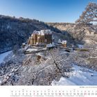 Kalenderblatt für Februar 2027 zeigt eine verschneite Burg Eltz in winterlicher Landschaft umgeben von Waldbäumen.