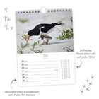 Kalenderseite für Mai, enthält ein Foto mit einem Austernfischer und Küken, sowie Platz für Notizen und eine Monatsübersicht.