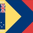 Der Text „Wombat“ ist kopfüber. Darstellung einer modifizierten australischen Flagge mit gelbem Dreieck und blauem Pfeil.