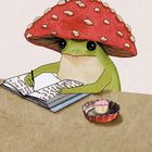 Ein Frosch mit Fliegenpilz-Hut schreibt in ein Buch, ein kleiner Cupcake steht daneben. Illustration auf hellem Hintergrund.