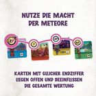 "NUTZE DIE MACHT DER METEORE", darunter Karten mit Zahlen und bunten Illustrationen, verbunden durch eine Linie.