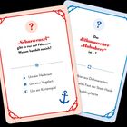 Zwei Karten mit Fragen: 
1. "Scharwenzel", nur auf Fehmarn. A: Heilkraut, B: Vogelart, C: Kartenspiel.
2. "dithmarscher 'Hohnbeer'" ist...?