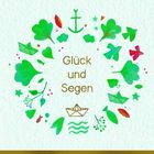 „Glück und Segen“ in der Mitte, umgeben von grünen Kleeblättern, Anker, Vögeln und Papierbooten.