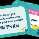 Text: "Erst bin ich gelb, dann weiß und flauschig – und das ganz ohne Zauberei. WAS BIN ICH?", "Lösung: Löwenzahn". Illustration von einem Eichhörnchen mit Gießkanne.