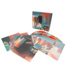 "Armin van Buuren" und "Feel Again" auf einer Box. Bunte, grafische Designs auf Platten und Drucksachen verteilt.