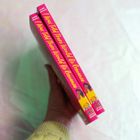 Zwei Bücher mit pinkem Cover. Titel: "I Was Told There Would Be Romance" von Marie Arnold. Gehalten von einer Hand.