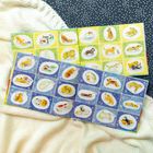 22 Z zz. Zwei geöffnete Kinderbücher mit bunten Tierillustrationen auf gelben und blauen Hintergründen.