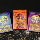 Bücher mit den Titeln "Which Way to Anywhere," "Which Way Around the Galaxy," und "Which Way to the Future" von Cressida Cowell.