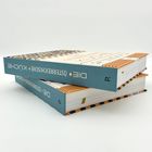 Zwei Bücher mit dem Titel "Die Österreichische Küche" liegen gestapelt, mit blauem Rücken und gestreiftem Cover.