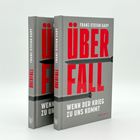 Text: "Überfall. Wenn der Krieg zu uns kommt. Franz-Stefan Gady."  
Abgebildet sind zwei graue Bücher mit rotem und weißem Text.