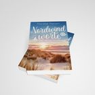 "Nordwindworte" von Marieke Hansen, Roman. Cover zeigt eine Strandlandschaft mit Dünen bei Sonnenuntergang.