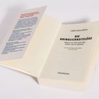 Titel: "Die Dringlichkeitslüge". Autor: Chris Guillebeau. Handbuchseite mit Text in Rot, Grün und Blau. Buch bei Goldmann.