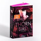 "Thornbird" von E. Kennedy, Thriller, mit "Spiegel Bestseller-Autorin". Ein Vogelsilhouette vor dunklen Blättern.