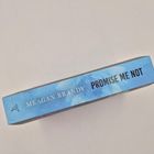 "MEAGAN BRANDY" und "PROMISE ME NOT" stehen auf einem blauen Buchrücken, verziert mit einem stilisierten Logo.