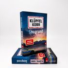 Text: "KLÜPFEL KOBR" "Seegrund" "Kriminalroman" "SPIEGEL Bestseller". 
Cover mit Berglandschaft und Polizeiauto.