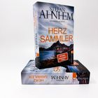 "Stefan Ahnhem - Herzsammler" auf zwei Buchcovern. Kriminalroman mit Berg- und Seelandschaft.